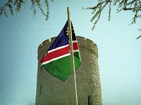 Okaukuejo Camp   Time for a well-earned lunch break after 6½ hours in the car except for our loo break.  This old fort also serves as a tourist camp: the Namibian flag is flying.